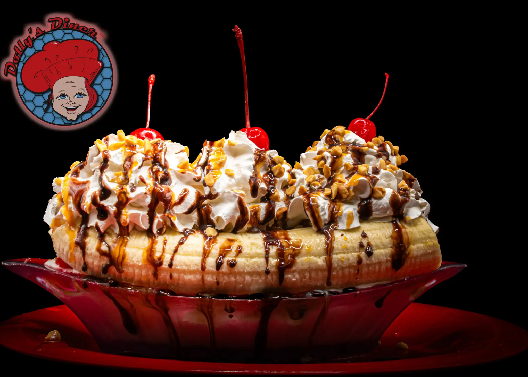 Banana split with cherries and whipped cream.