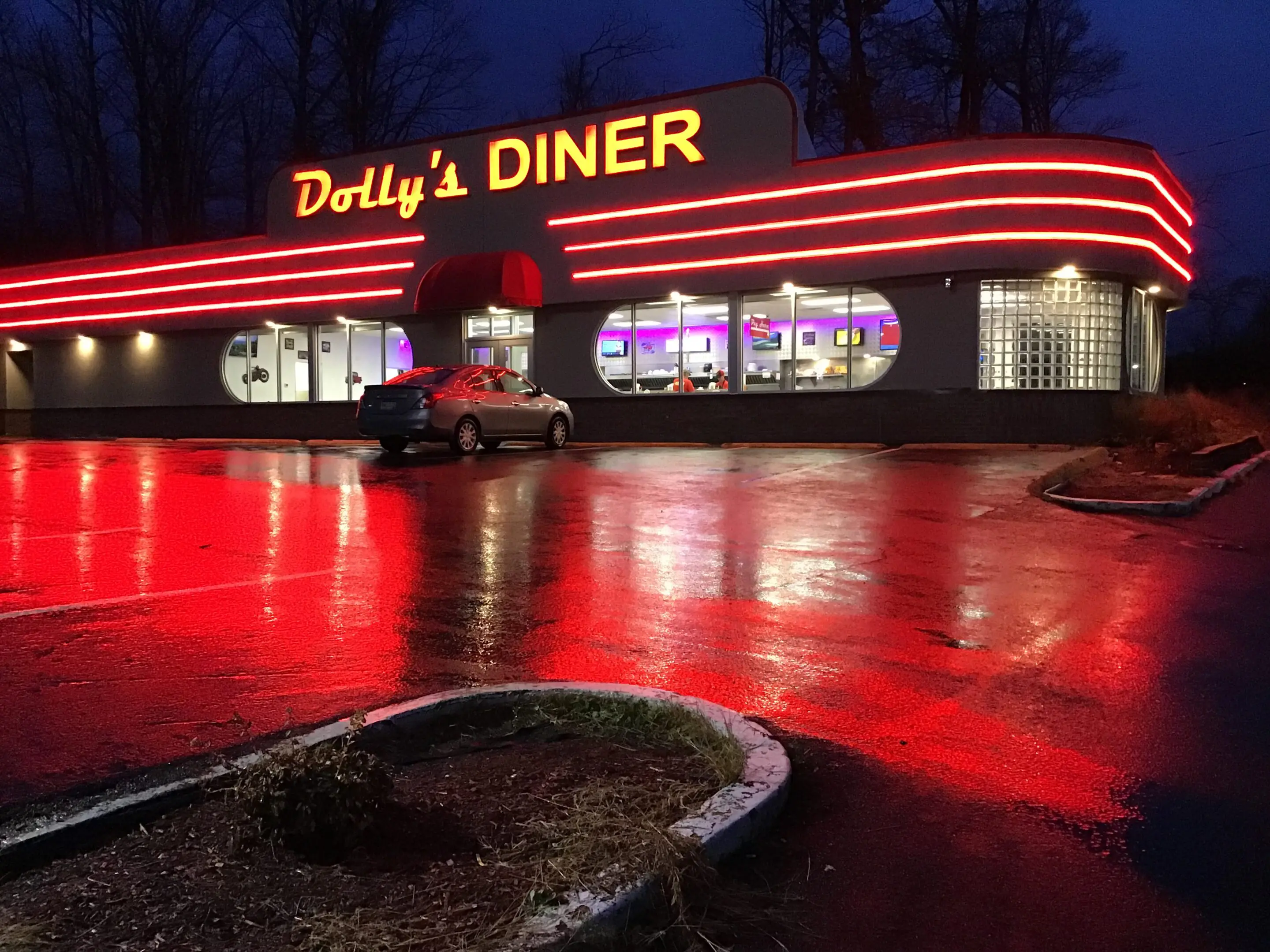 Retro diner with neon lights at night.