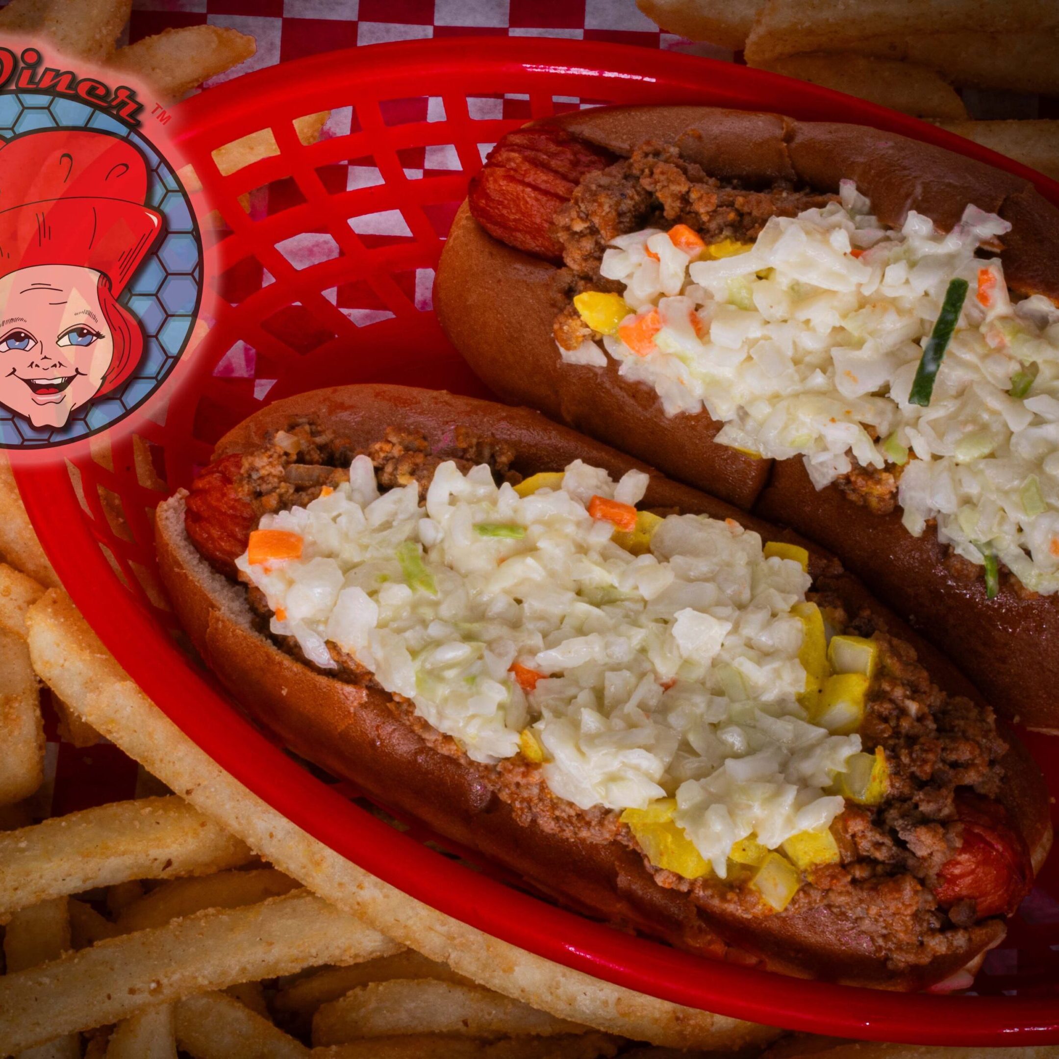 Hot dogs with toppings and fries basket.