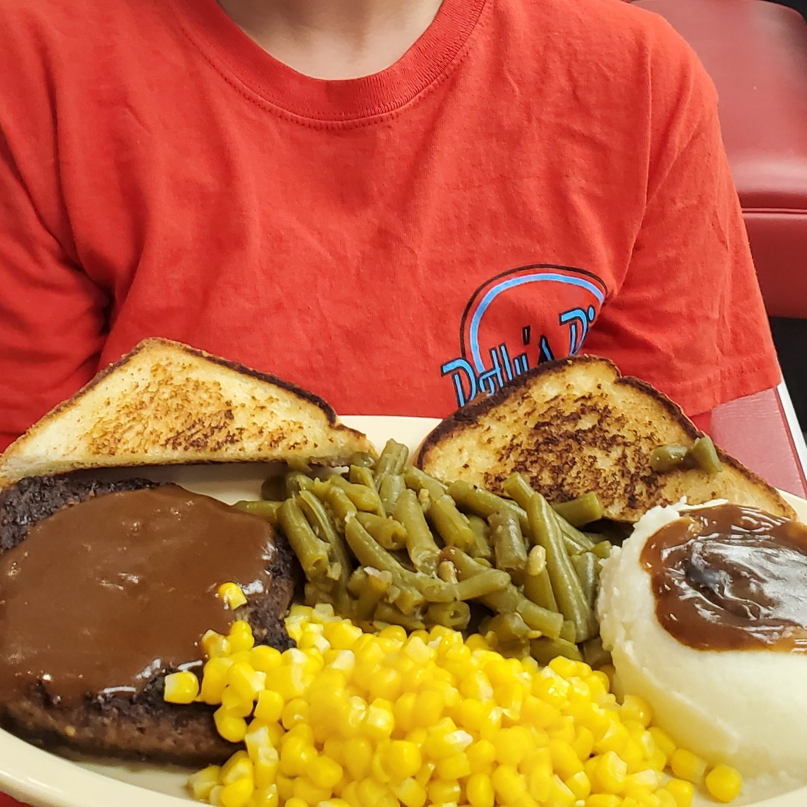 Plate of food with vegetables and bread.